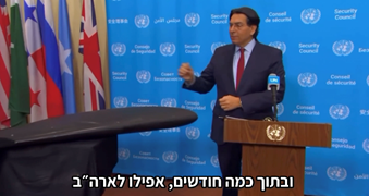 man speaking at podium