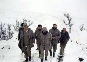 Rouhani (center) inspecting the war front with Commander Hashemi Rafsanjani, during the Iran-Iraq War.