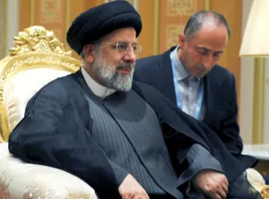 President Raisi listens to President Putin at the Turkmenistan summit on June 29, 2022