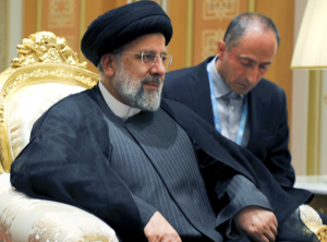 President Raisi listens to President Putin at the Turkmenistan summit on June 29, 2022